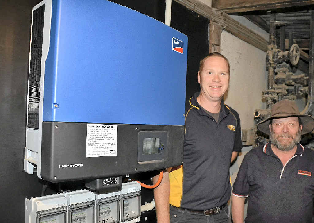 Tim Hourigan and Sam Giacca with the inverters, which convert the energy. Tim Hourigan and Sam Giacca with the inverters, which convert the energy.